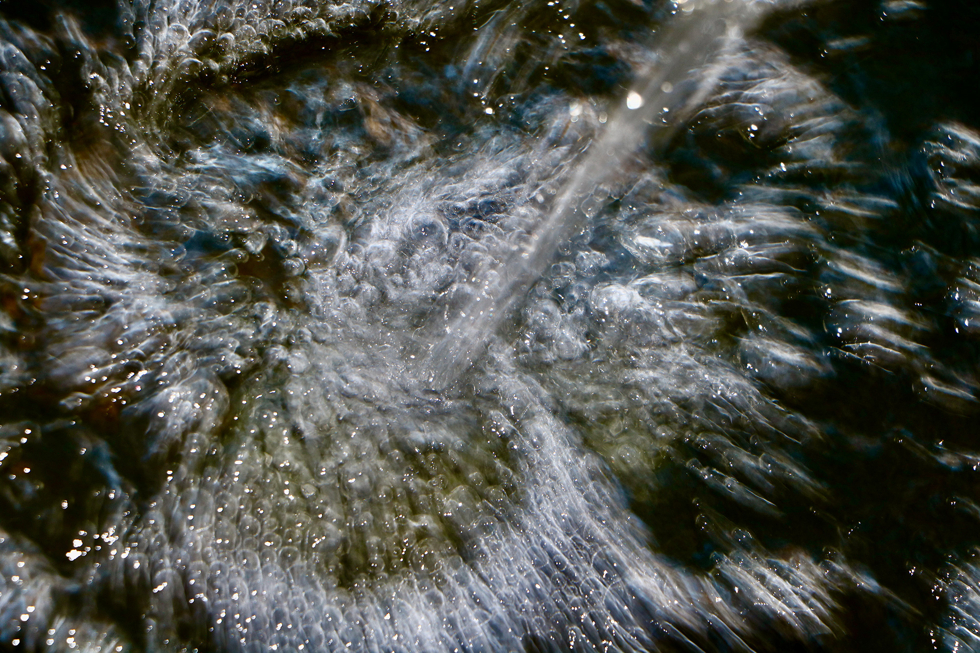 Grief support main page image close up stream water being with bubbles